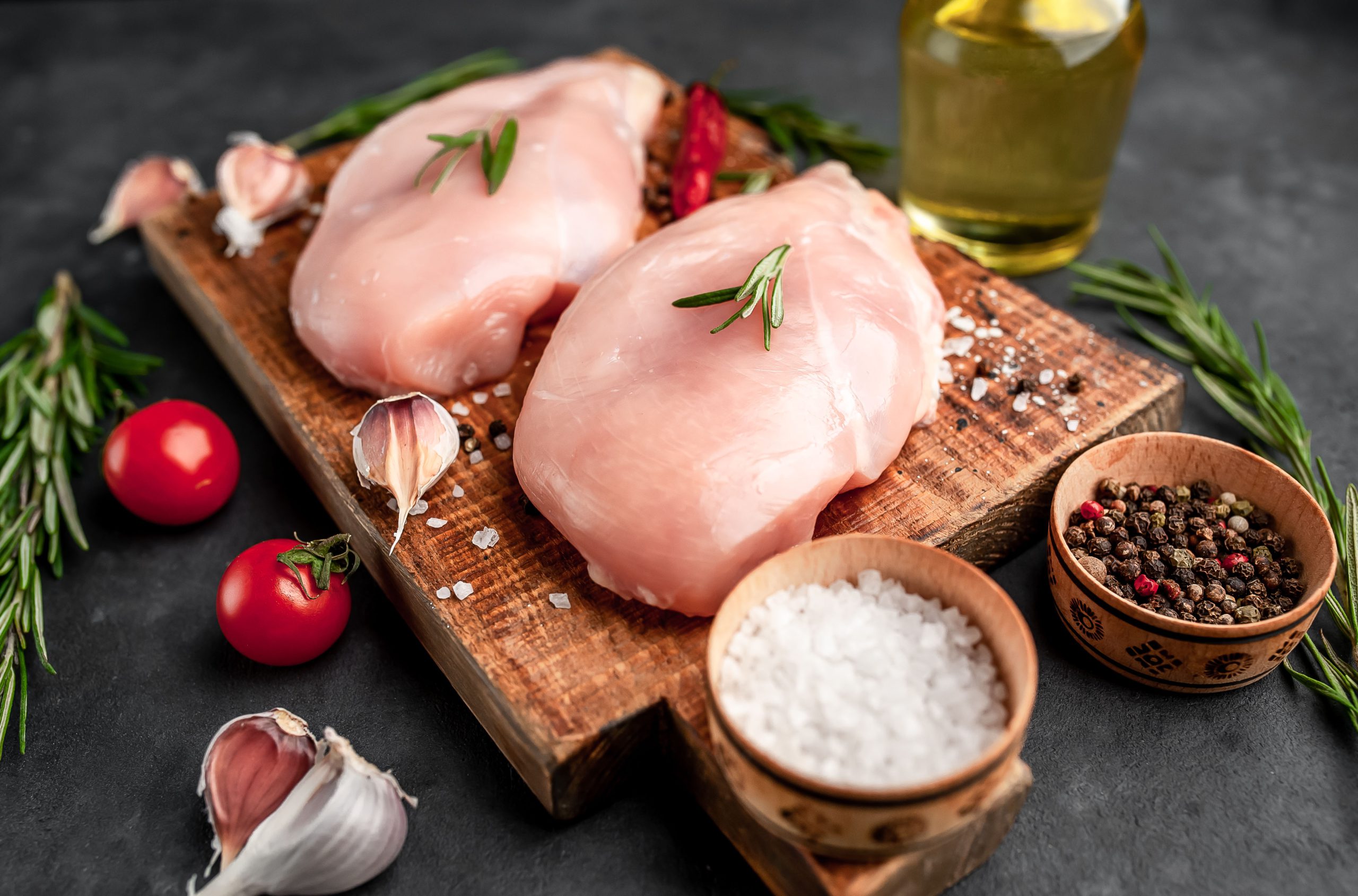 https://vega-meat.pl/wp-content/uploads/2025/04/raw-chicken-fillet-cutting-board-with-rosemary-spices-tomatoes-pepper-stone-background-scaled.jpg